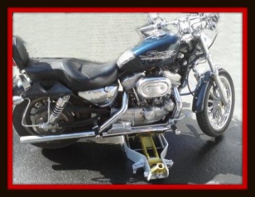 Motorcycle during a quality control check to make sure mothing has been missed by Fifty Dollar Detail.